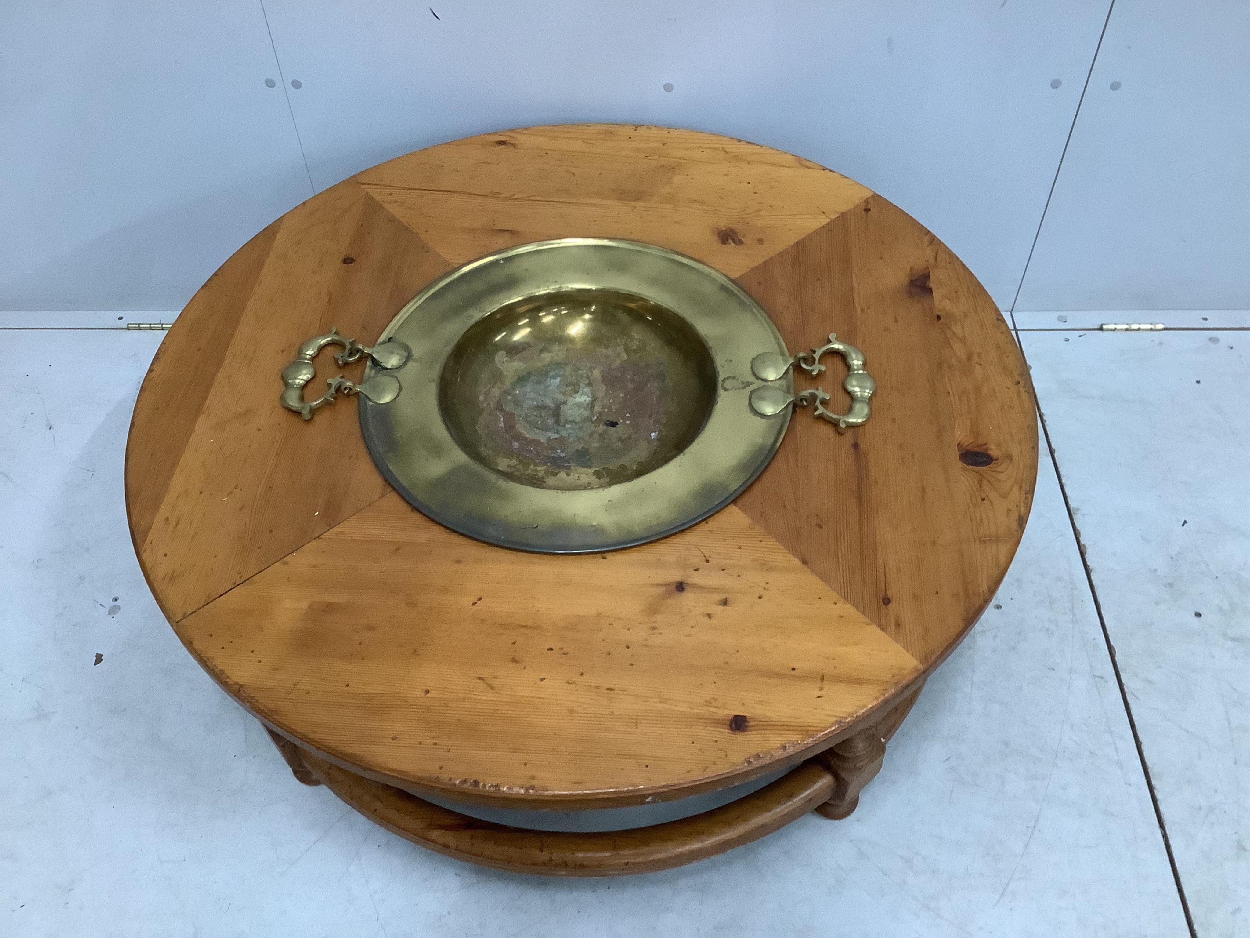 A Brazier Brassro circular pine coffee / cocktail table, diameter 110cm, height 42cm. Condition - fair